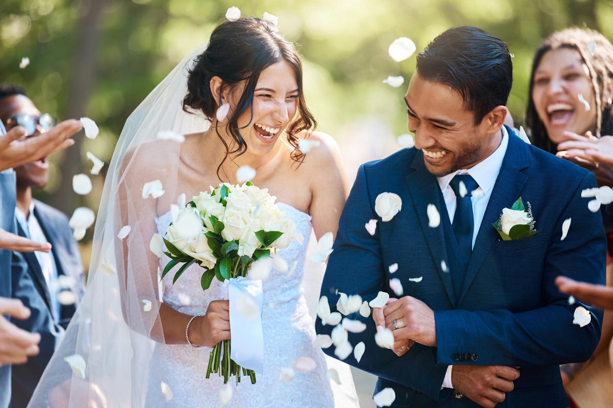 Wedding Couple with confetti and guests