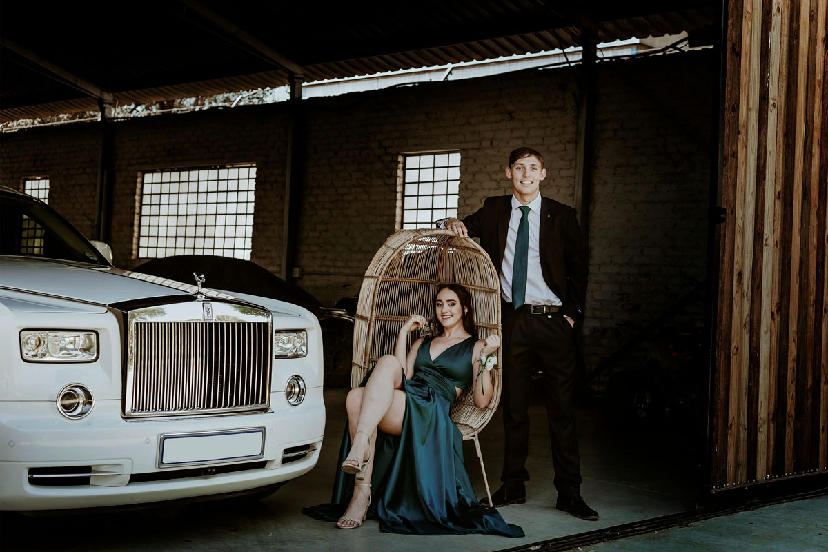 Couple posing with Rolls Royce